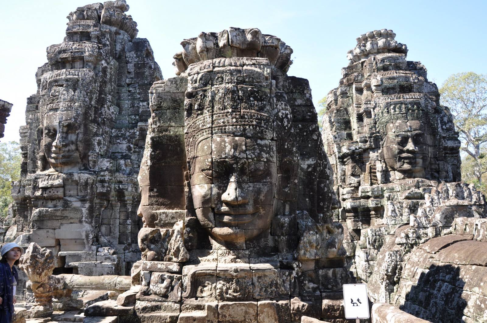 Smiling faces of Buddha statues in Bayon temple makes visitors emotional